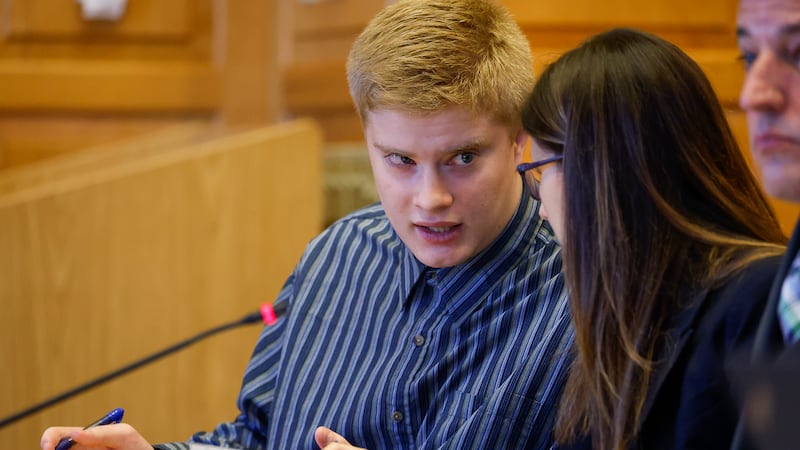 Jeremy Goodale (left) talks with his defense co-counsel Nicole Jensen during his sentence...