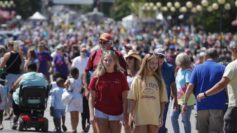 Thousands of fairgoers pack Grand Avenue during the Iowa State Fair on Friday, Aug. 13, 2021,...