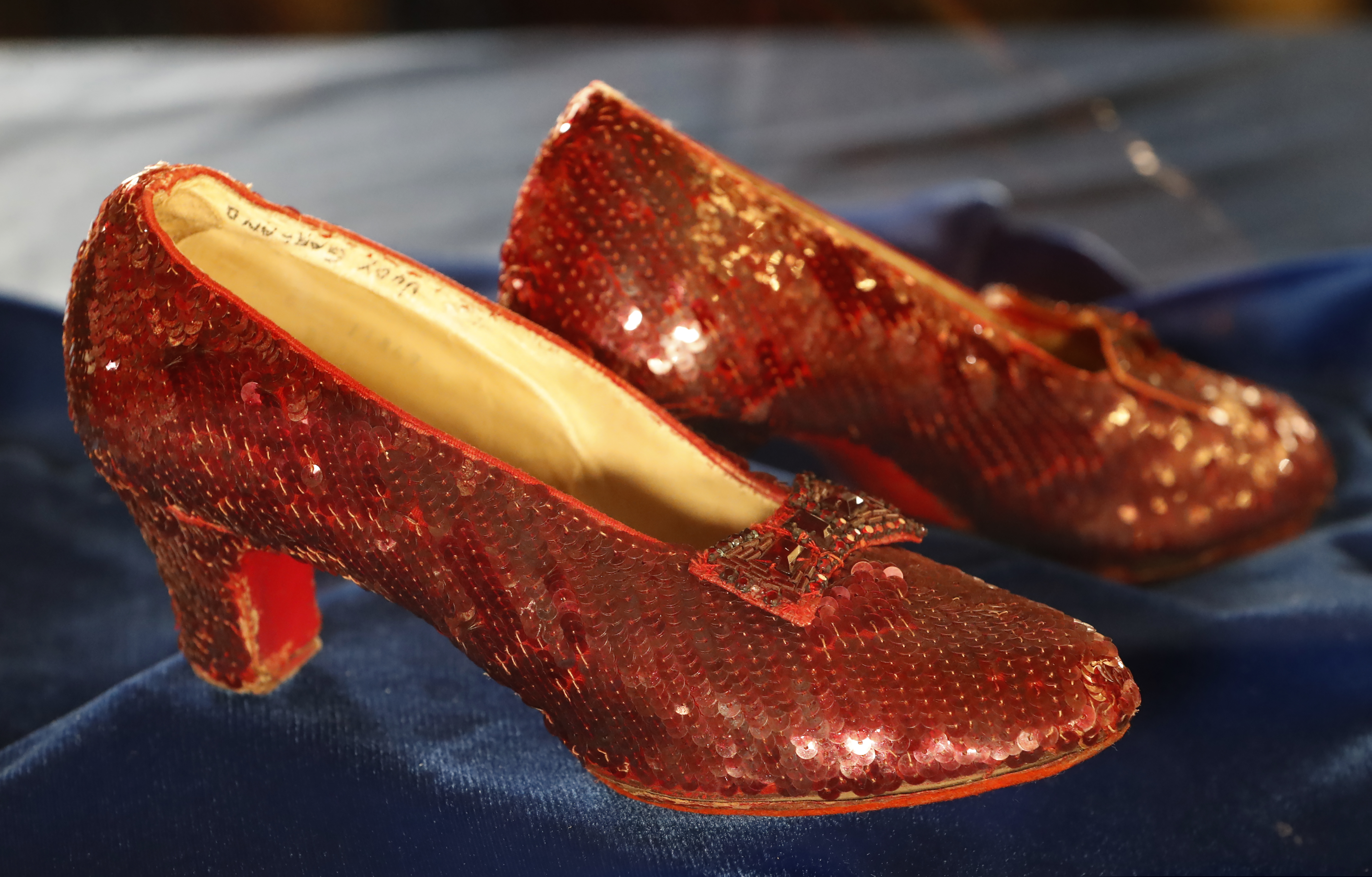 A pair of ruby slippers once worn by actress Judy Garland in the "The Wizard of Oz" are...