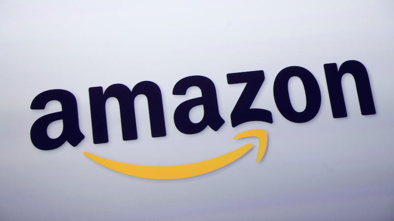 FILE - The Amazon logo is displayed at a news conference in New York on Sept. 28, 2011. Amazon...