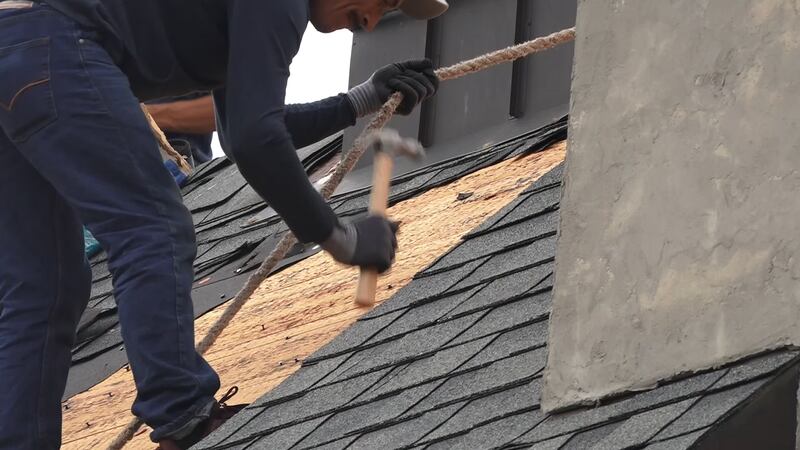 Roofers working out in the heat